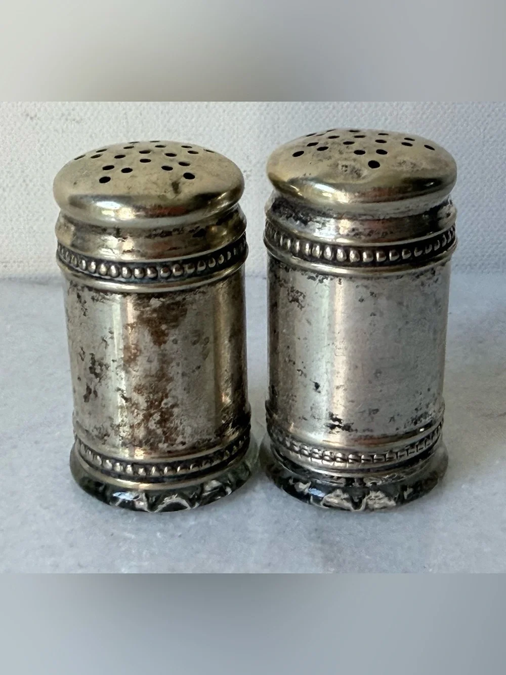 pair of antique EPNS silver salt and pepper shakers
